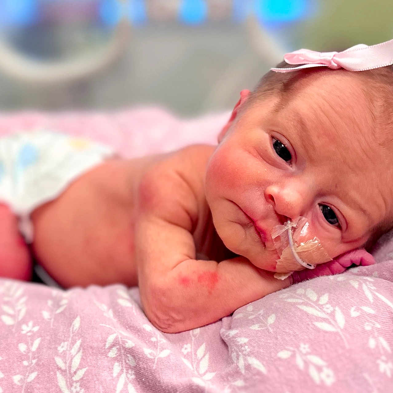 Emerald is registered to the contest to win money with this photo: architecture, baby, blanket, bodypart, building, diaper, face, finger, hand, happy, head, hospital, newborn, person, photography, portrait, smile, spitting