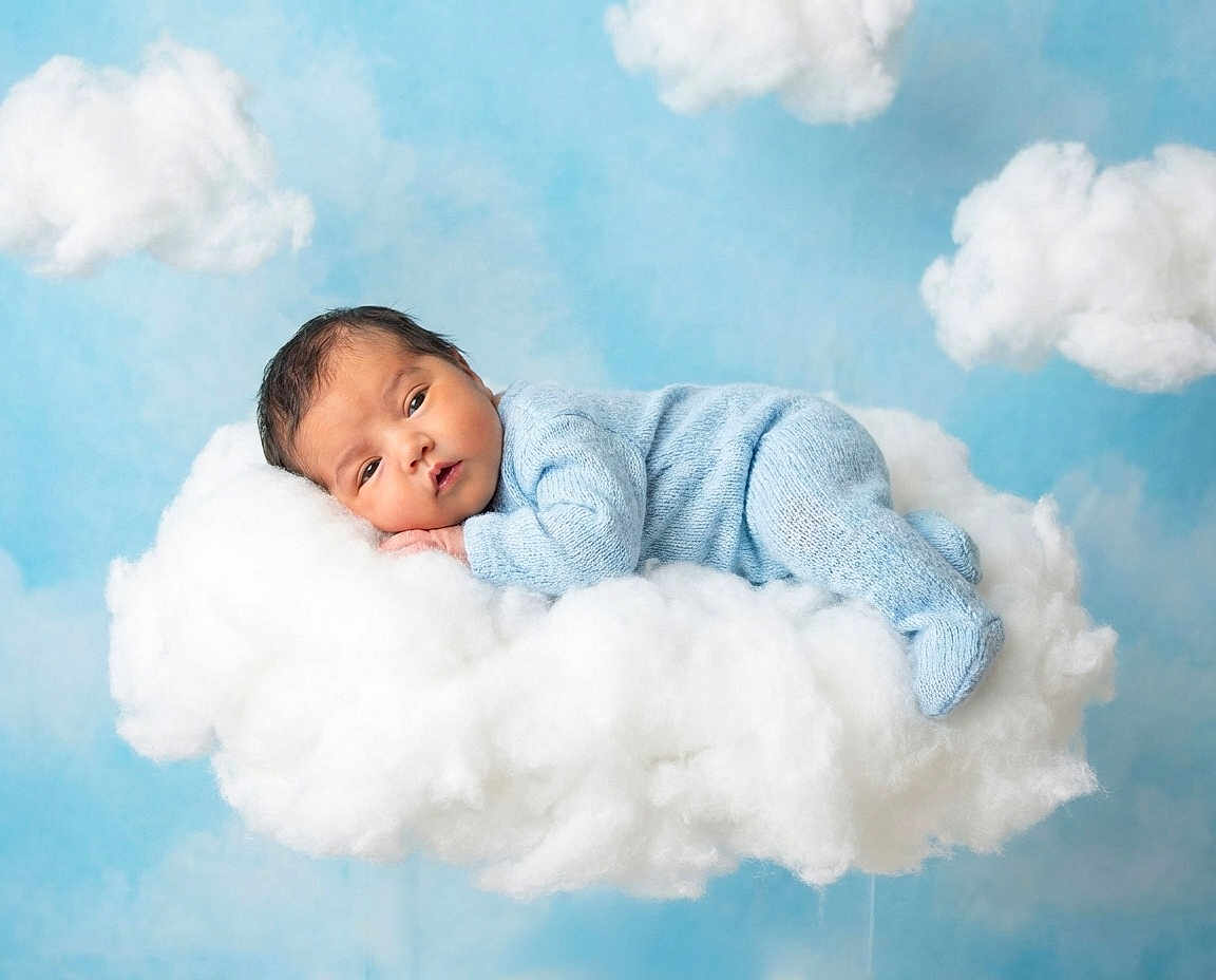 Aurora joined the competition — help win amazing prizes! baby, infant, blue_clothing, knitted_outfit, cloud, fluffy, sleeping, peaceful, sky, background, studio_photo, soft_light, newborn, portrait, cute, child, cozy, resting, dreamy, whimsical