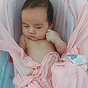 Aurora is registered to the contest to win money with this photo: baby, blanket, child, cozy, cute, expression, face, fingers, hand, indoors, infant, lying_down, newborn, peaceful, pink, portrait, resting, skin, soft, wrapped