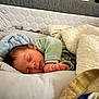 Sohan a rejoint le concours — aidez-le/la à gagner de superbes lots ! baby, infant, newborn, sleeping, blanket, bedding, pillow, mattress, cozy, peaceful, closed_eyes, hand, face, onesie, swaddle, nursery, soft_texture, comforter, bed, portrait
