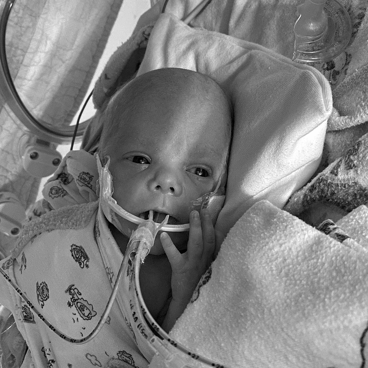 Ophelia is registered to the contest to win money with this photo: art, auto_part, automotive_design, baby, baby_products, baby_toddler_clothing, black, black_and_white, car_seat, child, comfort, facial_expression, glass, monochrome, monochrome_photography, sitting, stock_photography, style, toddler, white