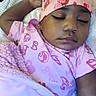 baby, bed, blanket, cap, child, closeup, cozy, cute, earrings, face, hand, indoor, infant, onesie, peaceful, pink, portrait, resting, sleeping, soft