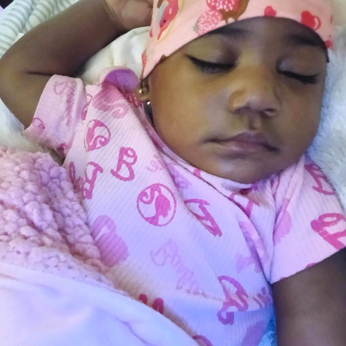 Za'Kaylei is registered to the contest to win money with this photo: baby, bed, blanket, cap, child, closeup, cozy, cute, earrings, face, hand, indoor, infant, onesie, peaceful, pink, portrait, resting, sleeping, soft