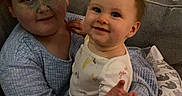 Hazel joined the competition — help win amazing prizes! children, baby, toddler, sibling, portrait, smiling, cuddling, sitting, couch, indoor, home, pillow, blanket, infant, family, face, hands, long_sleeves, patterned_fabric, photography