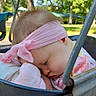 baby, sleeping, child, infant, headband, pink, floral_outfit, blanket, swing, playground, outdoor, park, trees, sunlight, portrait, face, closed_eyes, nap, resting, peaceful