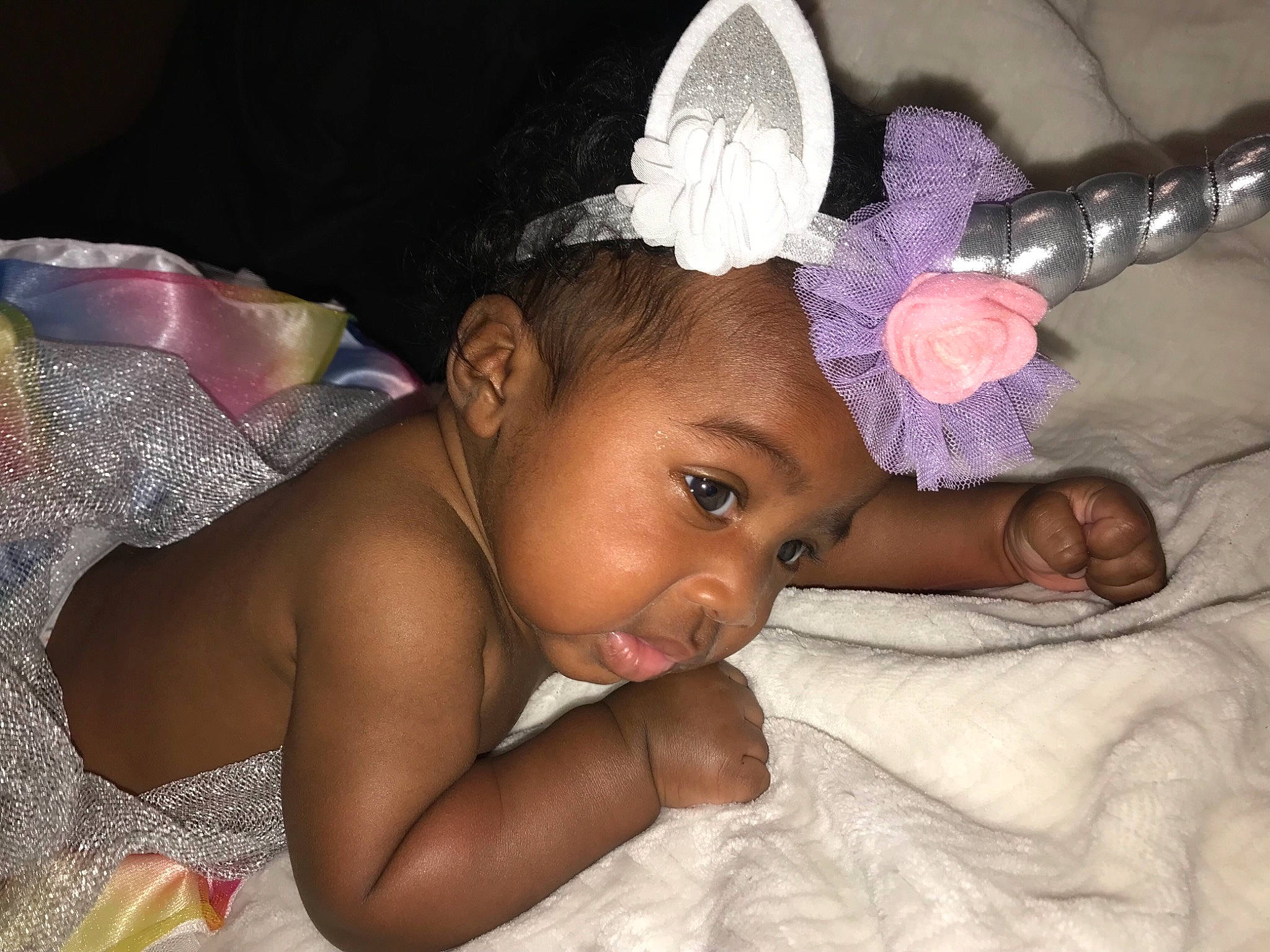 Carmen is registered to the contest to win money with this photo: black_hair, cheek, child, finger, fun, girl, hair_accessory, hand, headgear, infant, mouth, person, skin, toddler