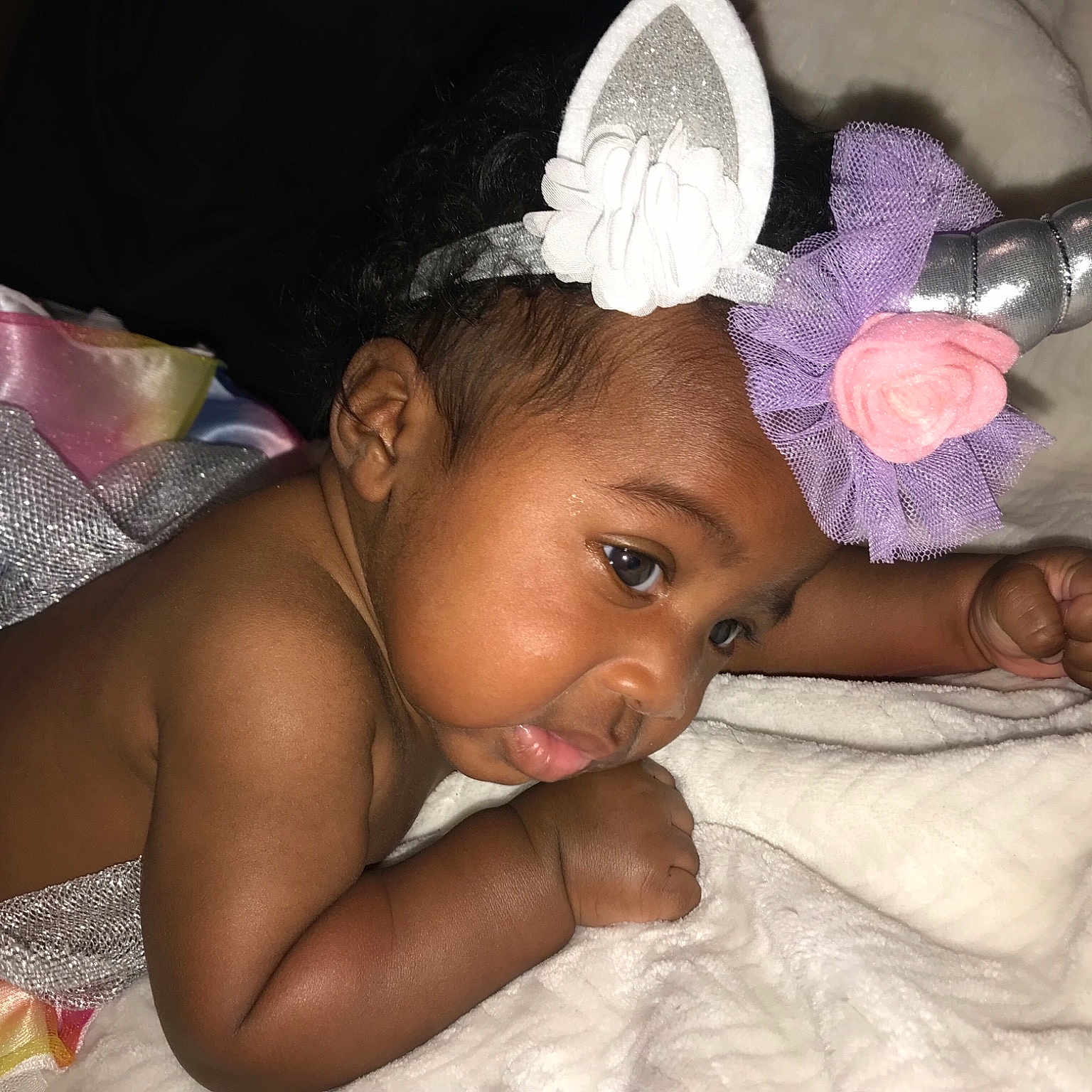 Carmen is registered to the contest to win money with this photo: black_hair, cheek, child, finger, fun, girl, hair_accessory, hand, headgear, infant, mouth, person, skin, toddler