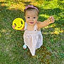 Ariah participe au concours pour gagner de l'argent avec cette photo : toddler, child, grass, outdoor, toy, yellow, dress, headband, pink, footwear, sandals, greenery, sunlight, happy, smiling, person, young_child, nature, play, summer