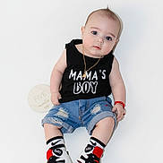 Liam joined the competition — help win amazing prizes! baby, boy, bracelet, casual, child, clothing, cute, denim_shorts, fashion, footwear, infant, necklace, portrait, shirt, sign, sitting, sneakers, socks, text_on_clothing, white_background