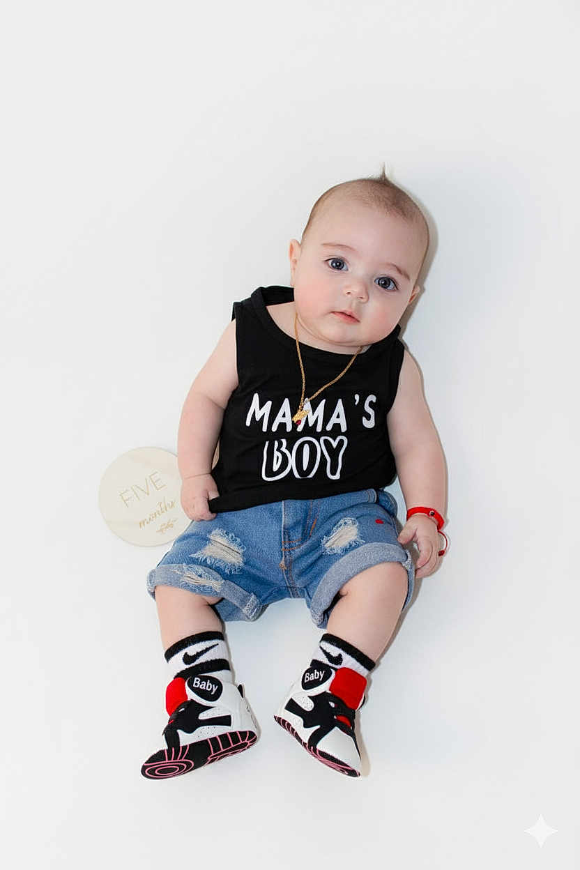 Liam joined the competition — help win amazing prizes! baby, boy, bracelet, casual, child, clothing, cute, denim_shorts, fashion, footwear, infant, necklace, portrait, shirt, sign, sitting, sneakers, socks, text_on_clothing, white_background