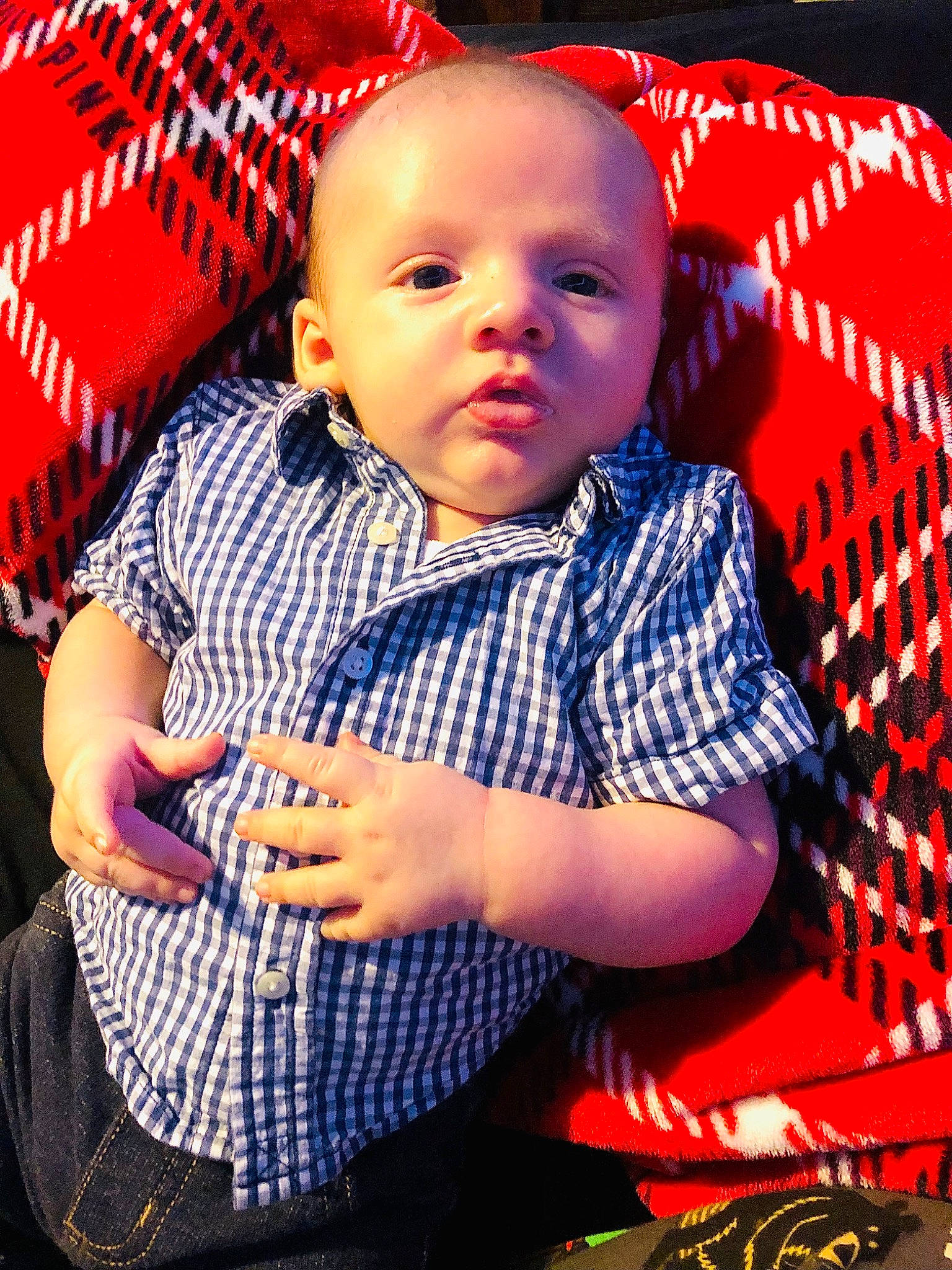 Beau is registered to the contest to win money with this photo: baby, baby_products, baby_toddler_clothing, cheek, child, cool, electric_blue, fun, happy, lip, magenta, pattern, person, plaid, product, sitting, skin, sleeve, t_shirt, textile