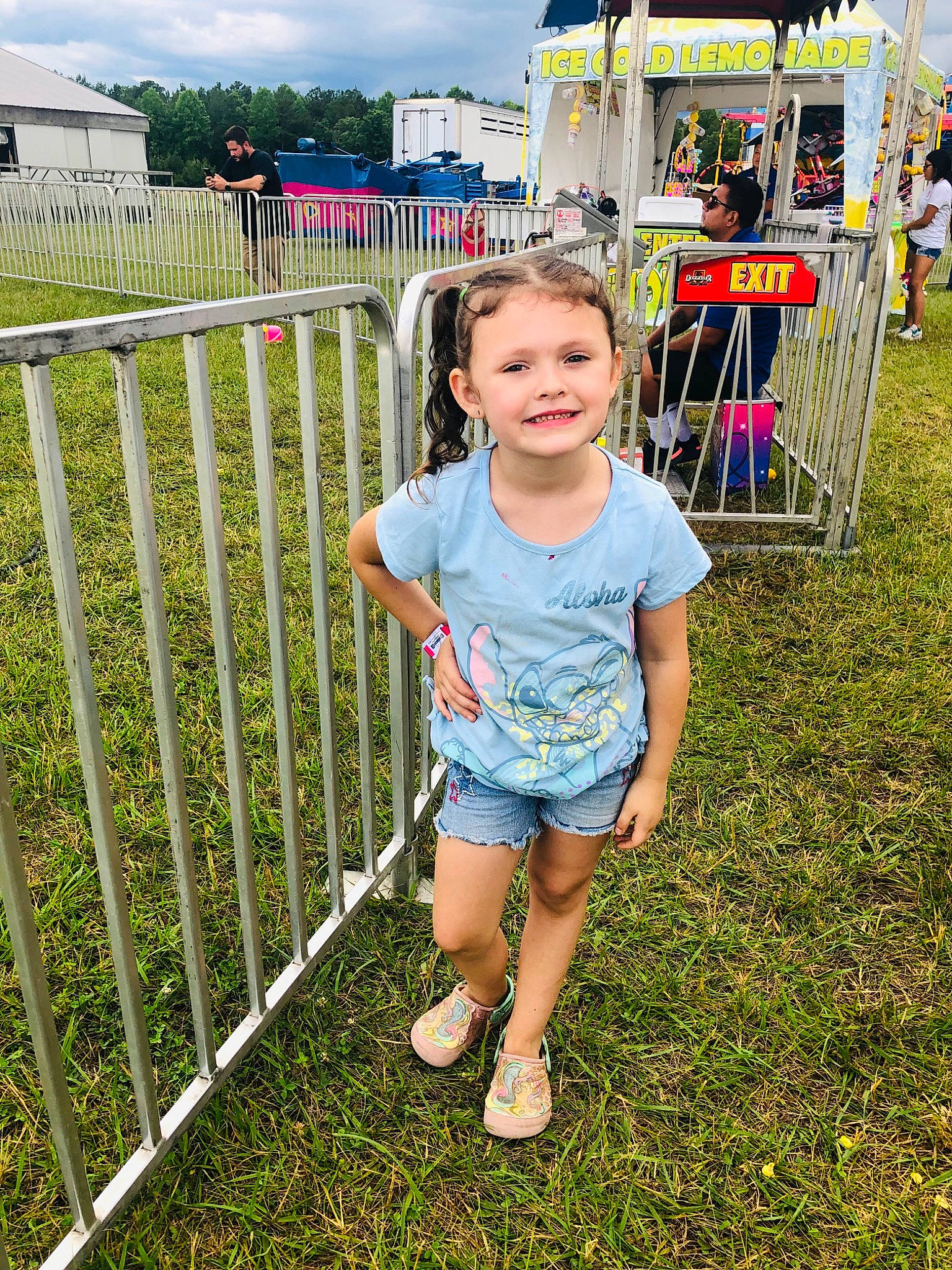Madilynn is registered to the contest to win money with this photo: child, city, fence, fun, grass, grassland, happy, home_fencing, joy, leisure, person, plant, recreation, sandal, shorts, sky, smile, spring, summer, t_shirt