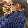 Coco Chanel is registered to the contest to win money with this photo: woman, man, puppy, dog, pomeranian, glasses, tortoiseshell_glasses, earring, navy_sweater, knitted_sweater, ponytail, holding, hands, indoor, portrait, face, cute, brown_fur, background_blur, smiling