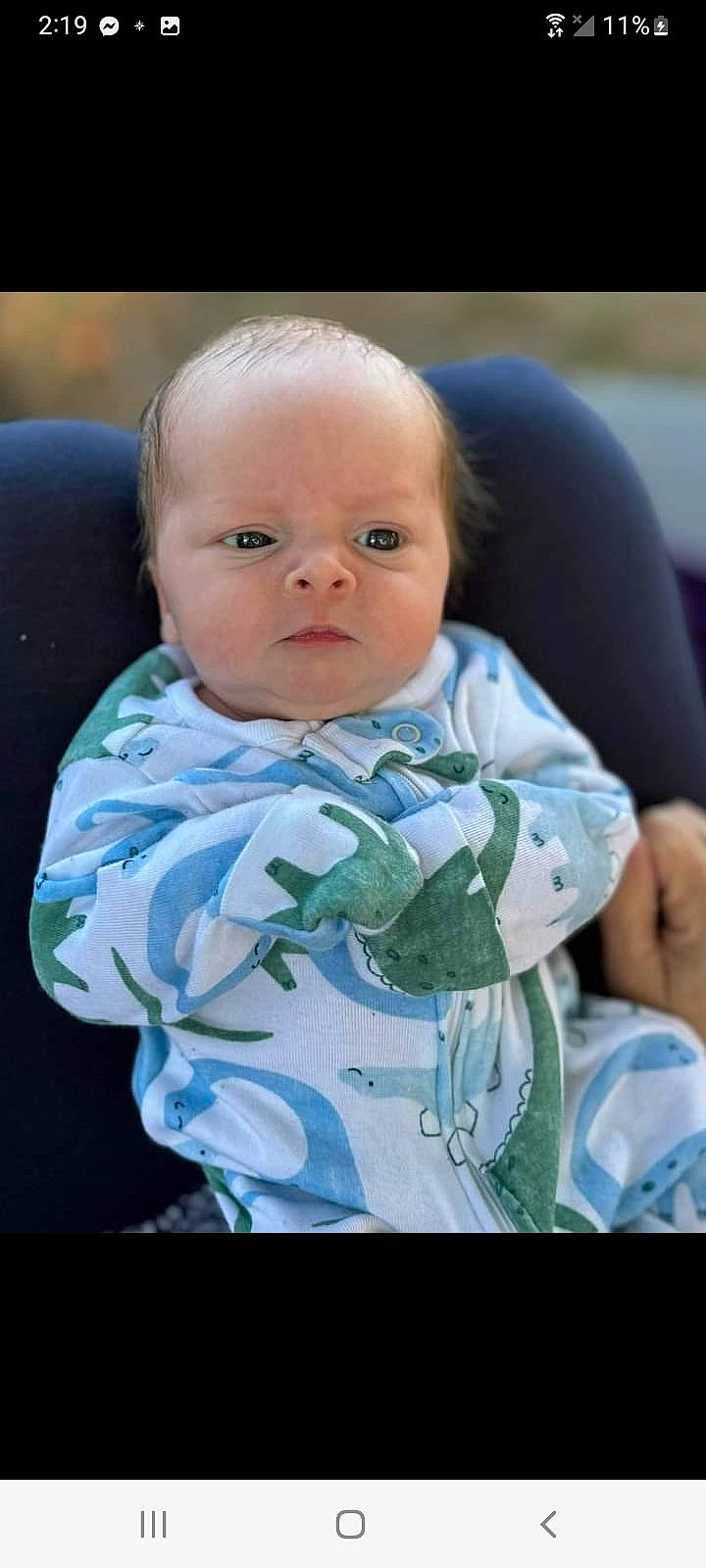 Michael is registered to the contest to win money with this photo: baby, baby_products, baby_toddler_clothing, cheek, child, comfort, event, eyebrow, flash_photography, fun, grass, happy, iris, linens, person, portrait_photography, room, sitting, sleeve, smile