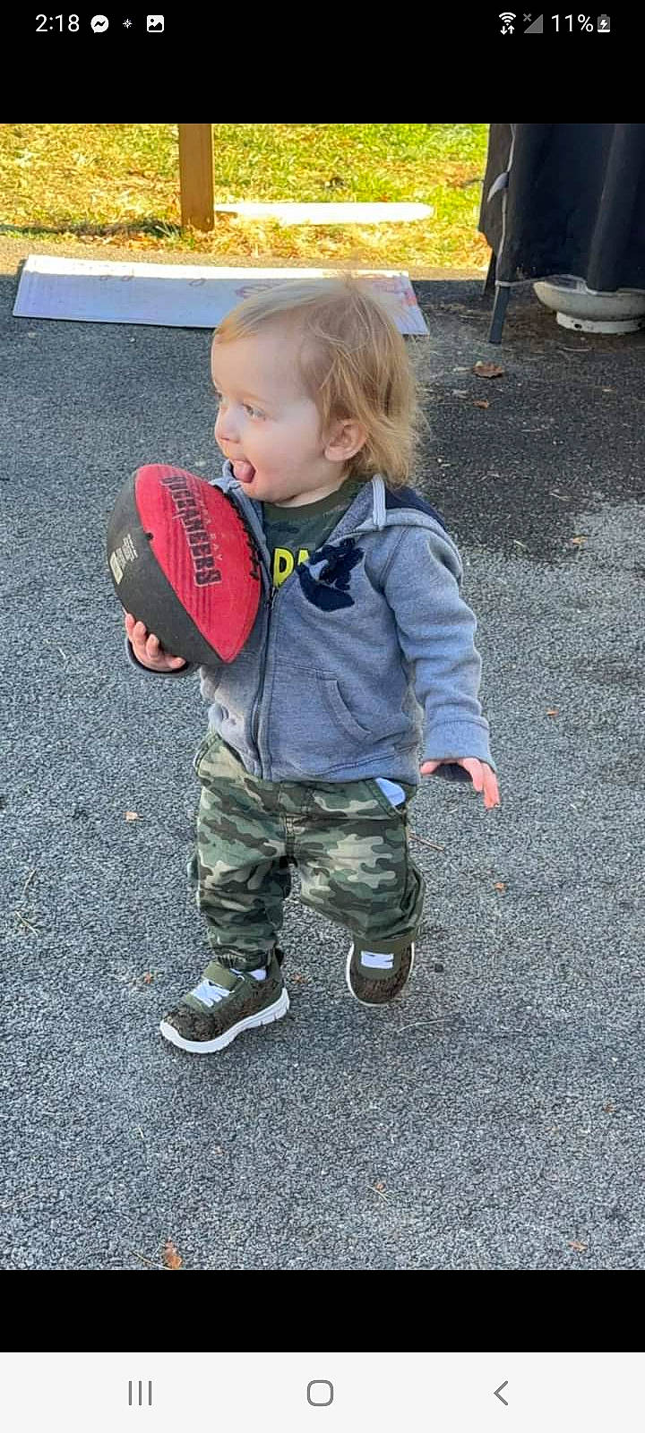 Bradley joined the competition — help win amazing prizes! asphalt, baby, baby_toddler_clothing, baseball_cap, cap, eye, grass, hand, hat, head, jacket, military_camouflage, people_in_nature, person, recreation, road_surface, sleeve, soil, sun_hat, toddler