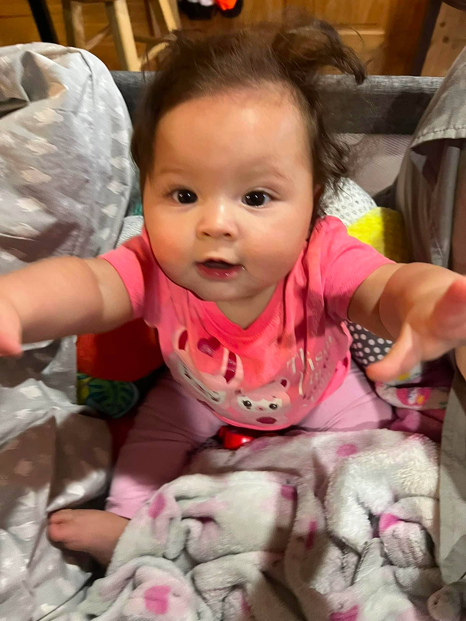Izzabella joined the competition — help win amazing prizes! baby, baby_toddler_clothing, cheek, child, eye, face, finger, fun, gesture, hairstyle, happy, head, linens, mammal, person, pink, sitting, skin, sleeve, smile