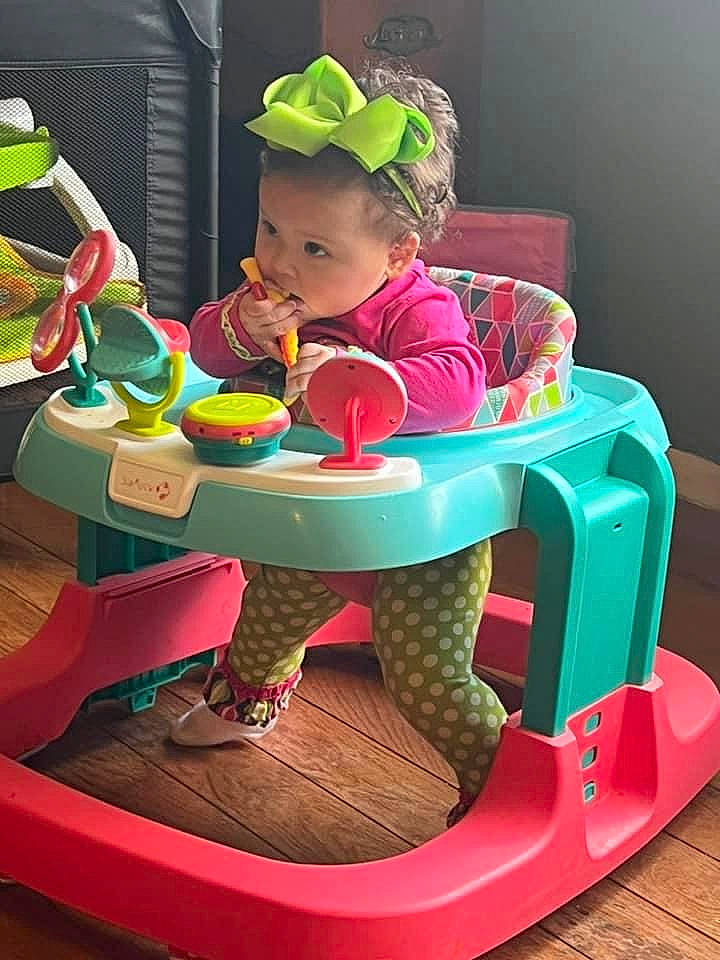 Izzabella joined the competition — help win amazing prizes! baby, baby_playing_with_toys, baby_products, baby_toddler_clothing, baby_toys, baseball_cap, cap, chair, child, fun, goggles, green, hat, leisure, magenta, person, pink, product, sharing, sitting