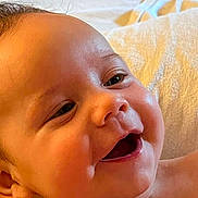 Carter joined the competition — help win amazing prizes! baby, smiling, close_up, face, infant, happy, skin, cheeks, eyes, mouth, expression, newborn, child, portrait, young, cute, warm_light, blanket, soft, indoors