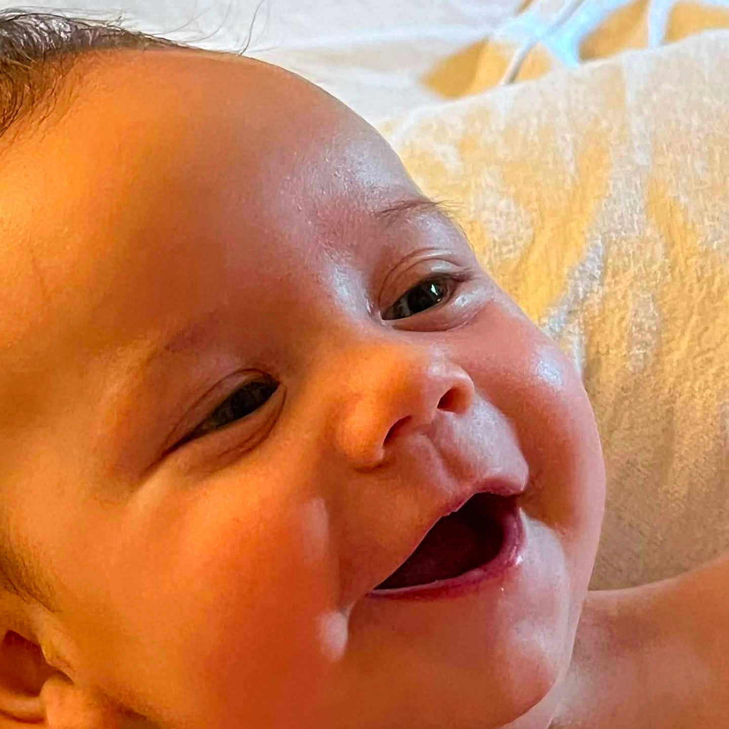 Carter joined the competition — help win amazing prizes! baby, smiling, close_up, face, infant, happy, skin, cheeks, eyes, mouth, expression, newborn, child, portrait, young, cute, warm_light, blanket, soft, indoors