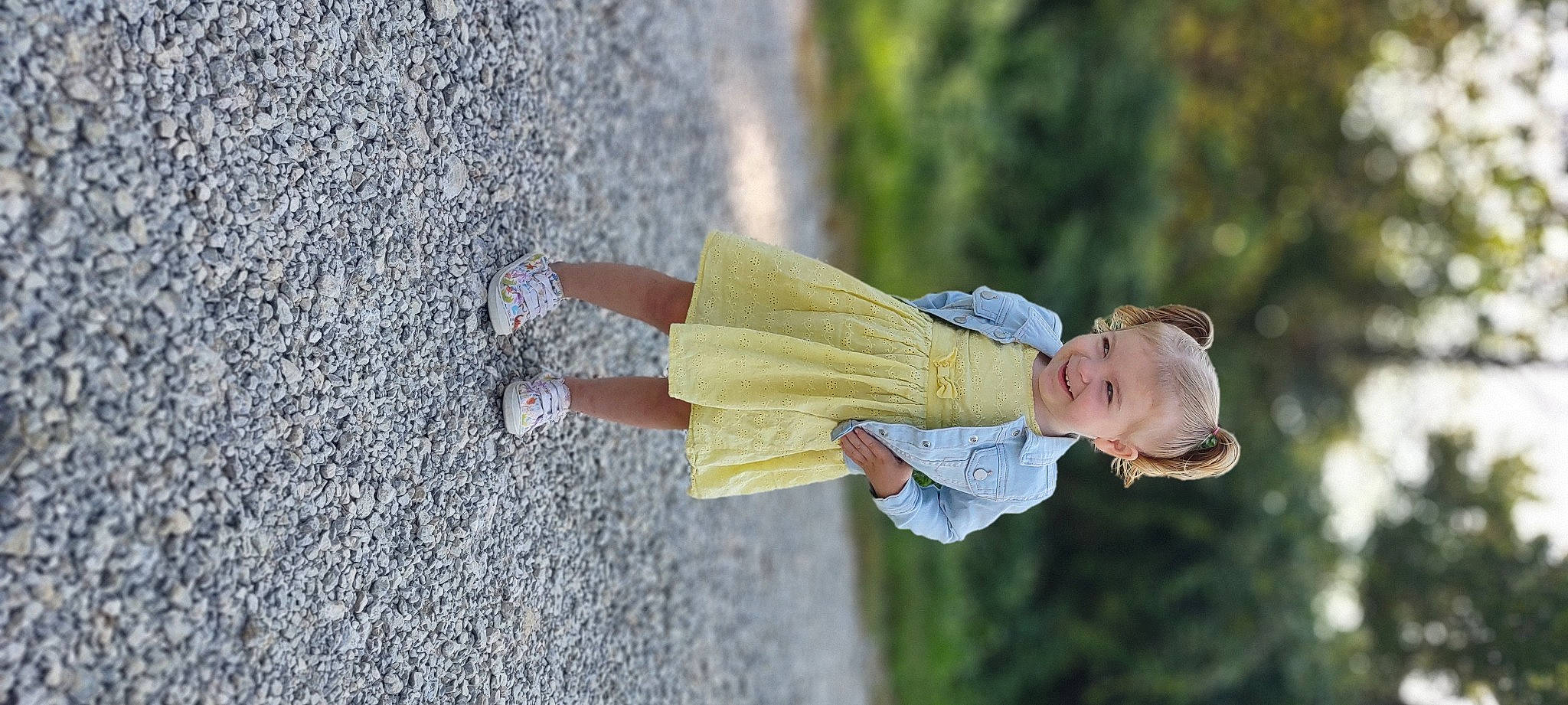 Luella is registered to the contest to win money with this photo: baby, child, dress, fun, gesture, grass, hand, happy, human_leg, joy, landscape, leisure, people_in_nature, person, plant, portrait_photography, recreation, smile, toddler, tree