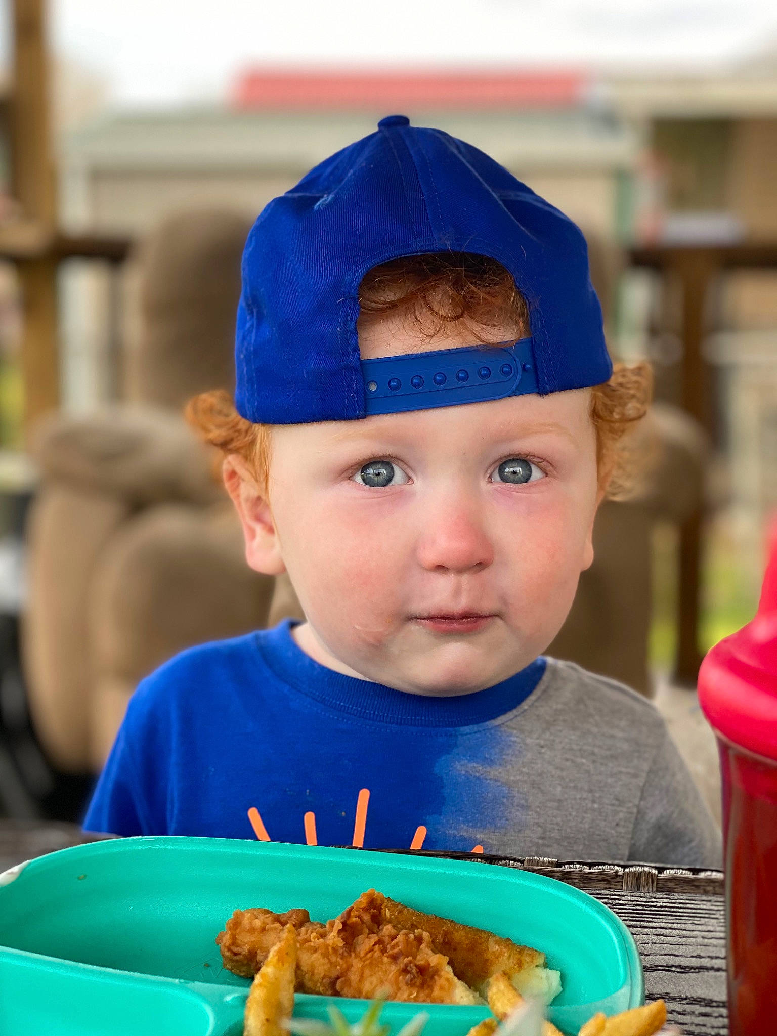 Travis is registered to the contest to win money with this photo: baby, baseball_cap, blue, cap, child, comfort_food, cuisine, electric_blue, facial_expression, fashion_accessory, food, fun, happy, head, headwear, ingredient, leisure, party_supply, person, sweetness