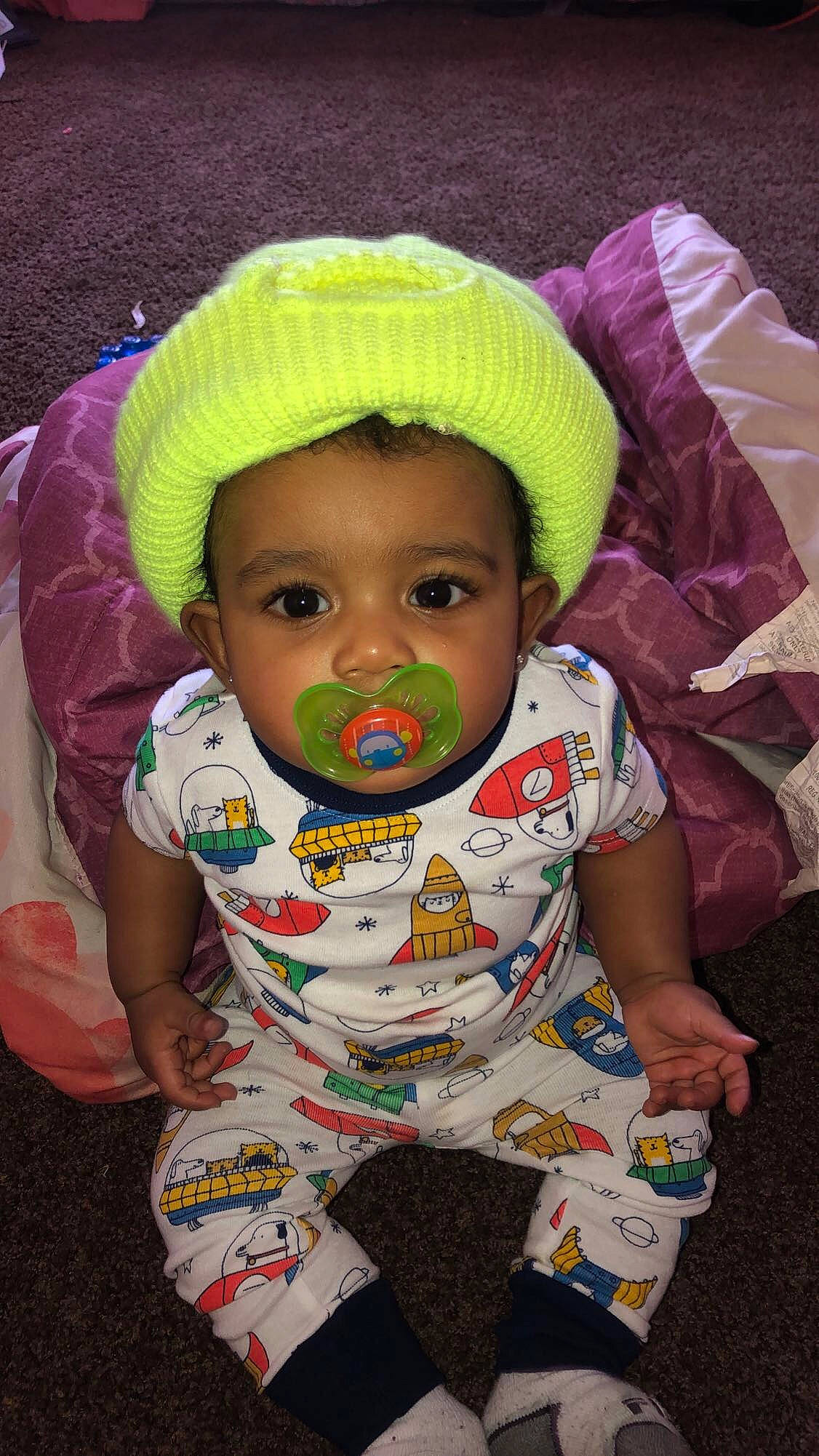 Dakari is registered to the contest to win money with this photo: baby, baby_toddler_clothing, cheek, chin, cool, eye, face, facial_expression, happy, head, human, lip, outerwear, person, pink, product, skin, sleeve, textile, toddler