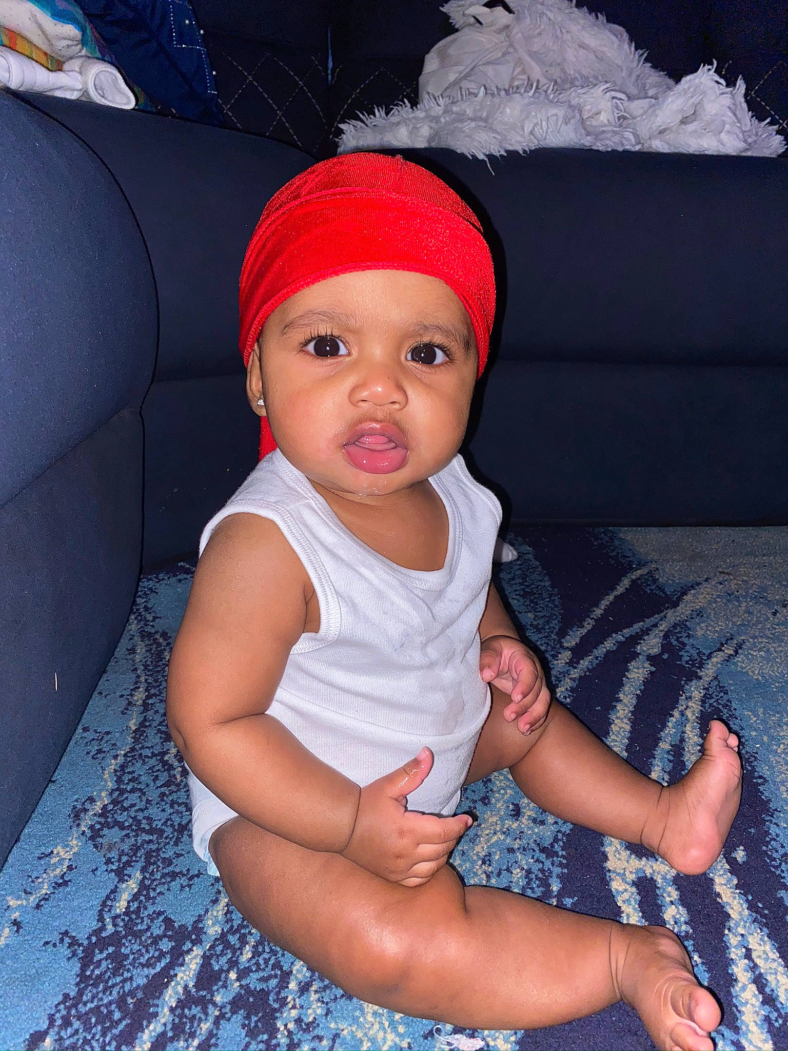 Dakari joined the competition — help win amazing prizes! baby, baby_toddler_clothing, baseball_cap, beanie, cap, carmine, child, costume_hat, fashion_accessory, fun, headgear, headwear, human_leg, knit_cap, pattern, person, pink, sitting, textile, thigh