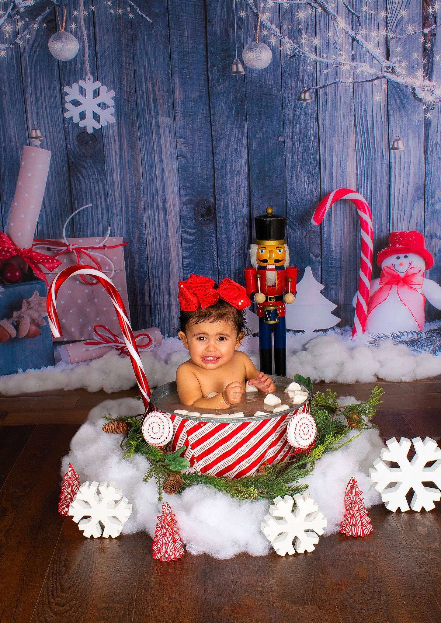 Layleigh is registered to the contest to win money with this photo: baby, child, christmas, christmas_decoration, christmas_eve, christmas_ornament, costume_hat, door, event, floral_design, hat, holiday, interior_design, joy, lawn_ornament, person, plant, red, santa_claus, toddler