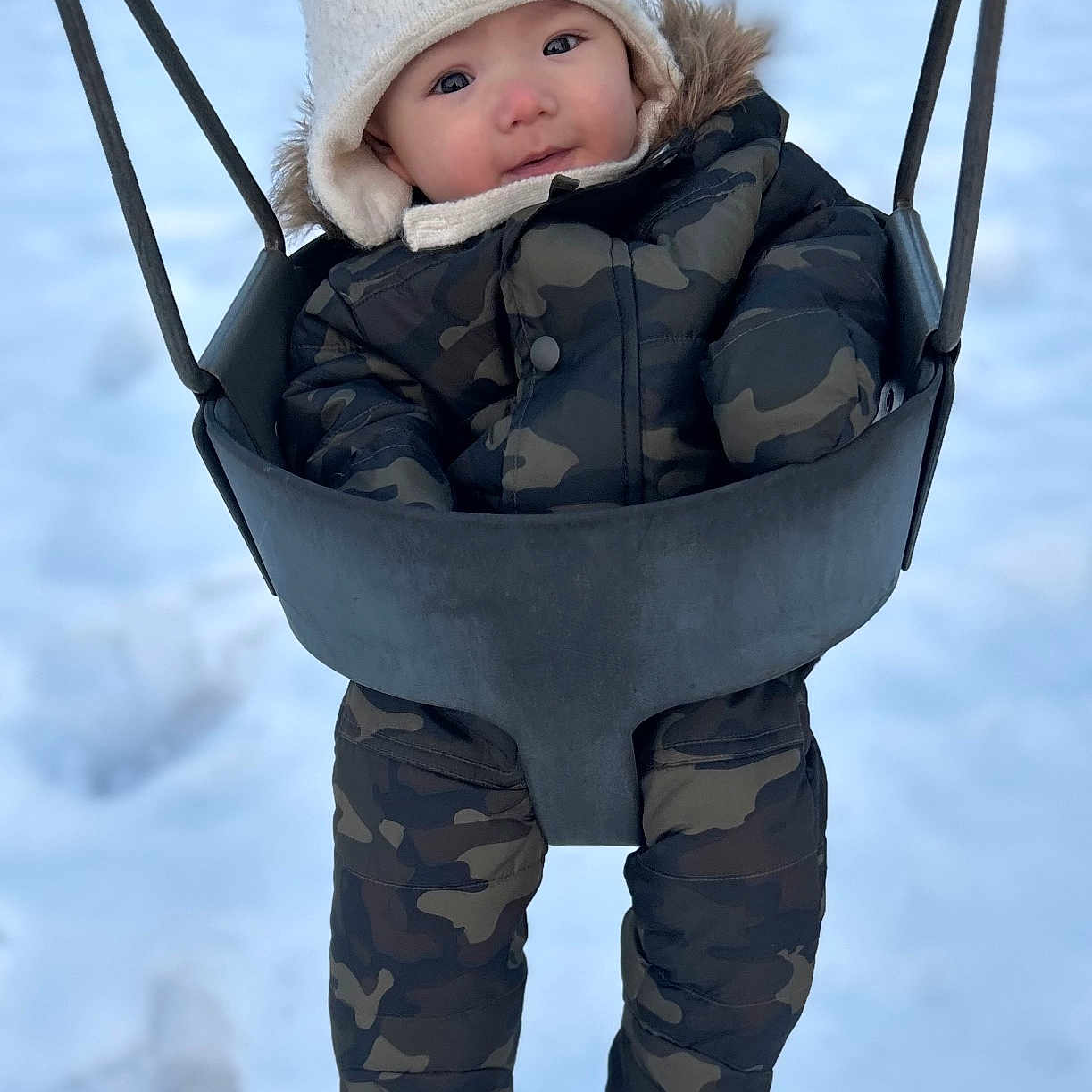 Anders is registered to the contest to win money with this photo: baby, bonnet, cap, clothing, coat, face, hat, head, hood, jacket, nature, outdoorplayarea, outdoors, pants, person, photography, playarea, portrait, snow, toy