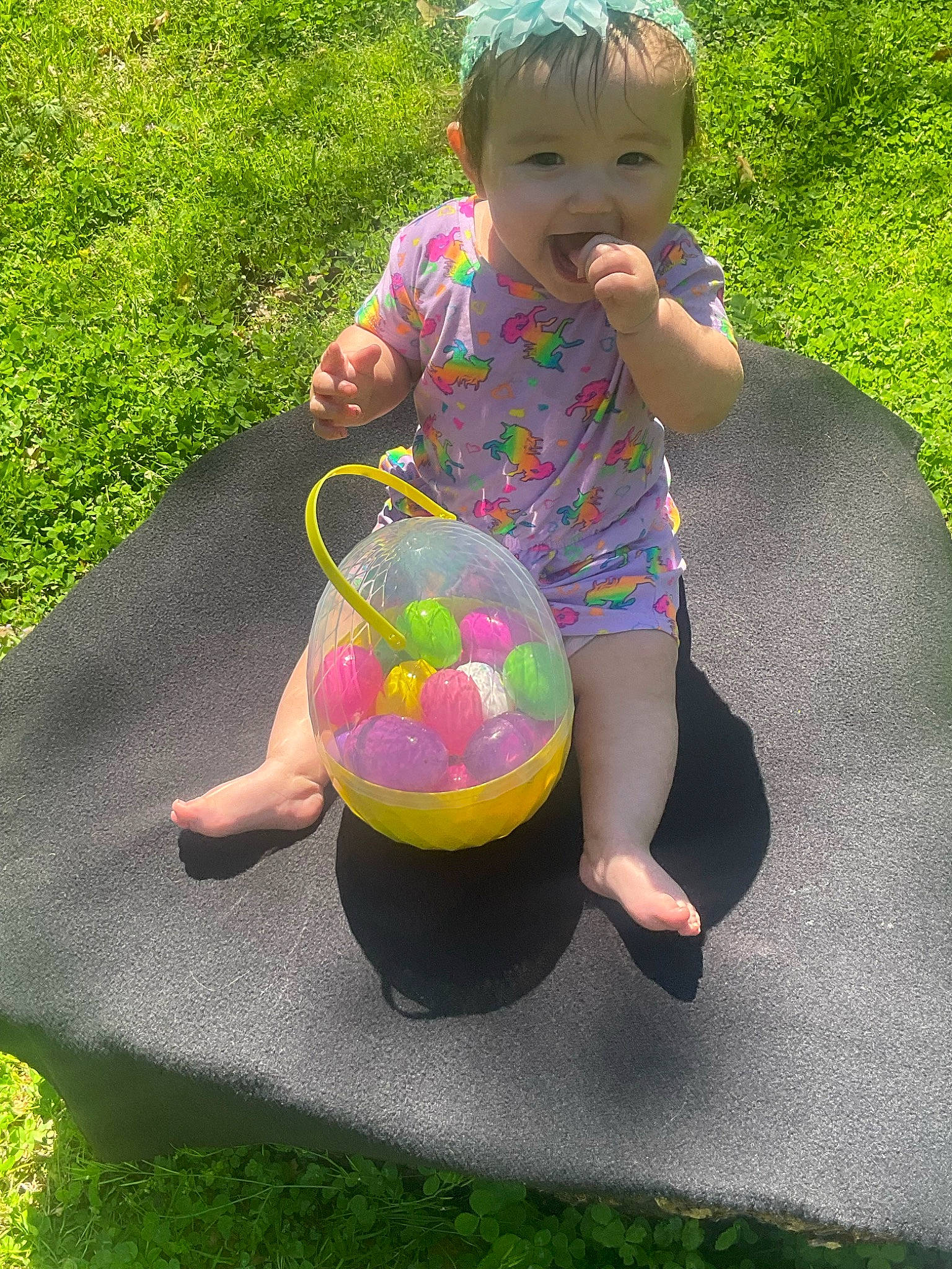 Georgia joined the competition — help win amazing prizes! baby, baby_products, baby_toddler_clothing, barefoot, child, fun, grass, happy, head, leisure, magenta, pattern, people_in_nature, person, pink, recreation, sitting, thigh, toddler, water