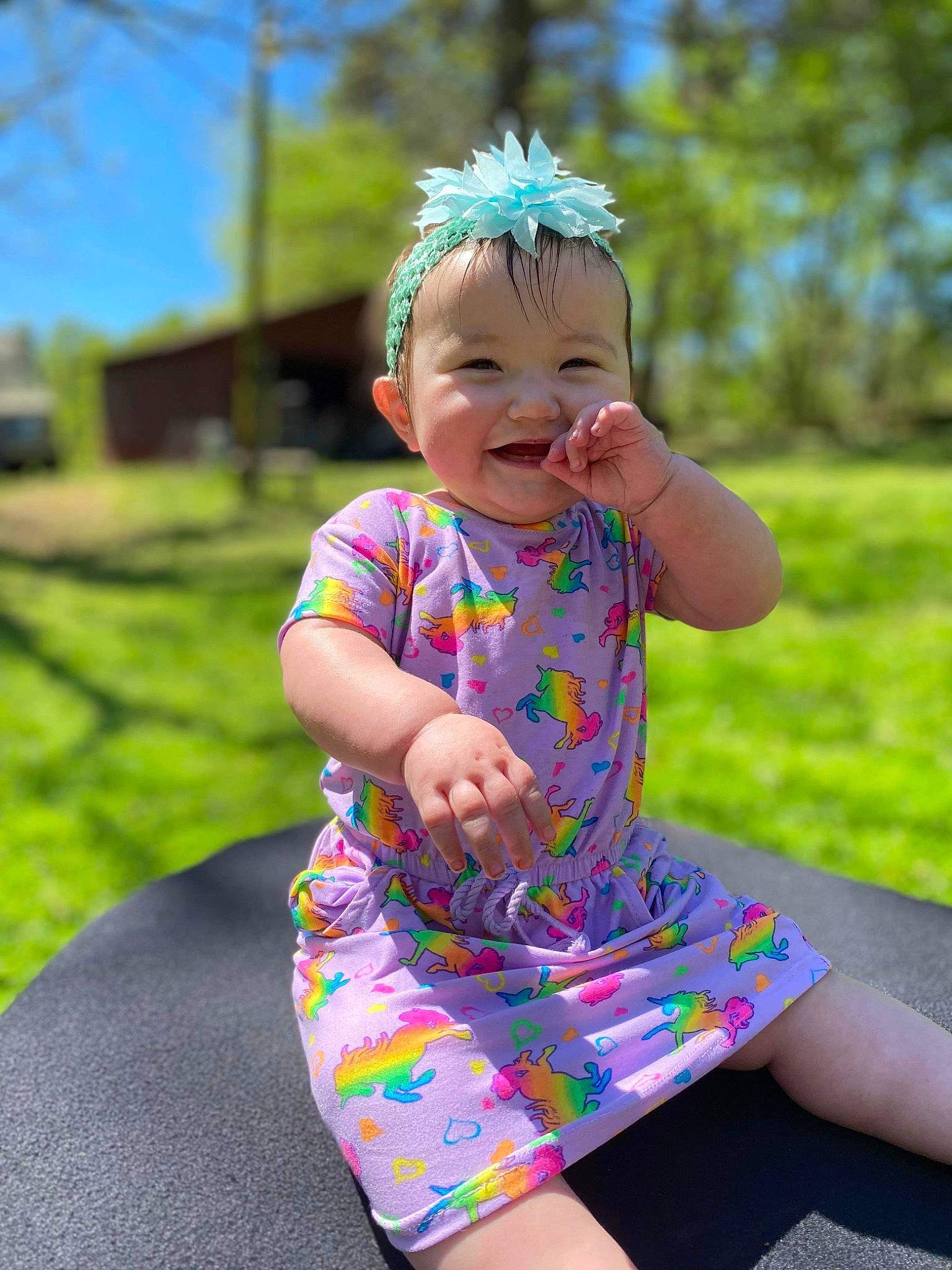 Georgia joined the competition — help win amazing prizes! baby_toddler_clothing, dress, eye, face, facial_expression, fun, grass, happy, head, joy, leisure, magenta, people_in_nature, person, pink, plant, skin, sky, sleeve, smile
