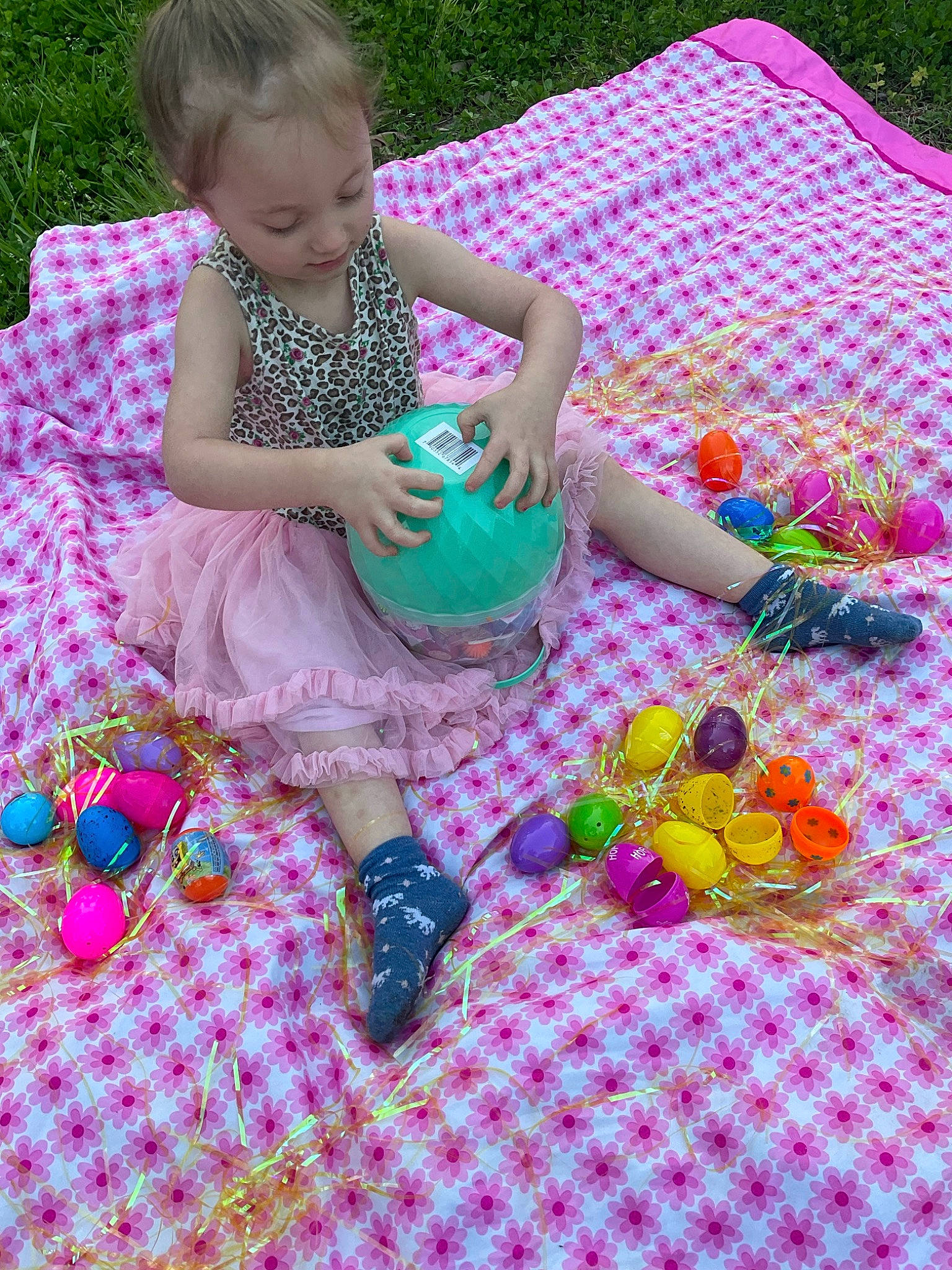 Brylynn is registered to the contest to win money with this photo: baby_products, baby_toddler_clothing, child, event, fun, grass, happy, leisure, linens, magenta, pattern, person, pink, play, purple, recreation, sandal, sitting, toddler, toy