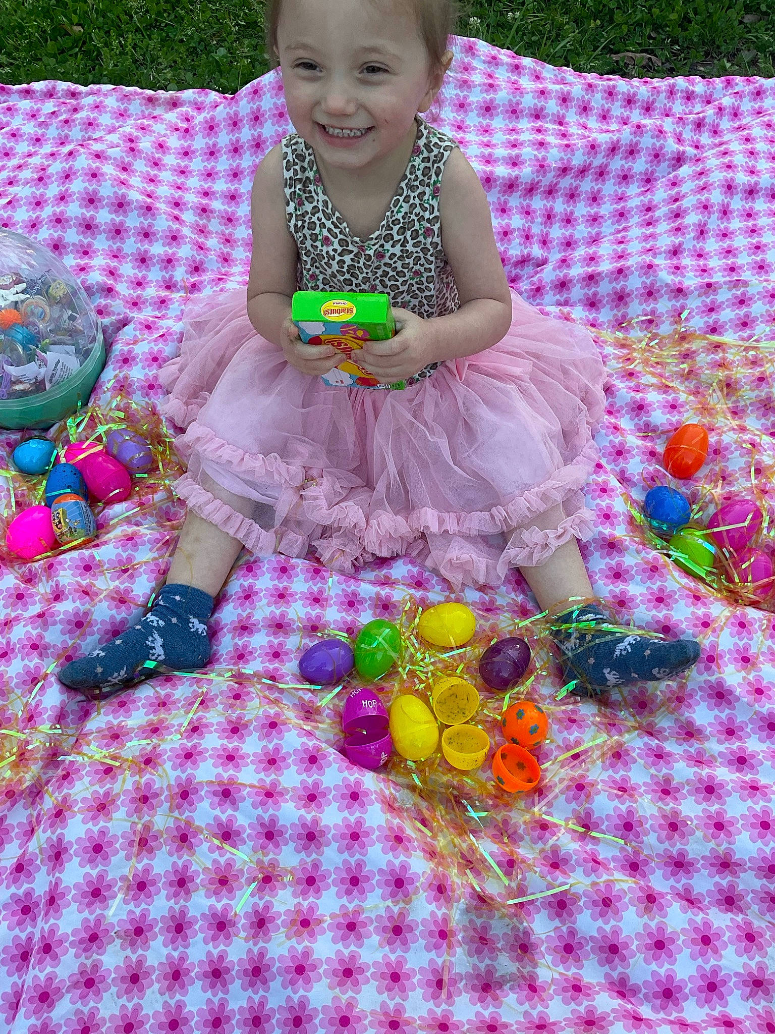 Brylynn is registered to the contest to win money with this photo: baby_products, baby_toddler_clothing, basket, child, dress, event, fun, grass, green, happy, joy, linens, magenta, pattern, person, pink, play, purple, recreation, sitting