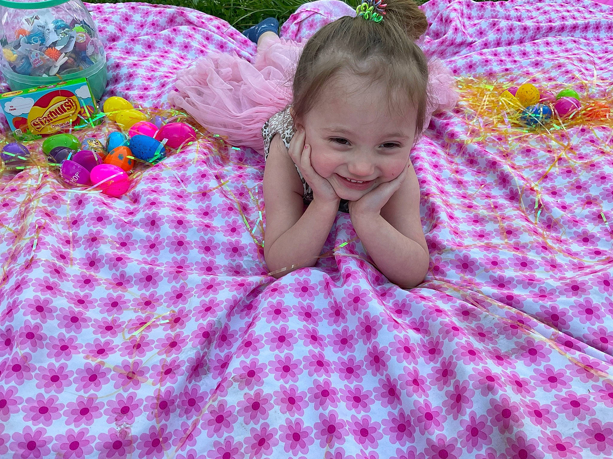 Brylynn is registered to the contest to win money with this photo: baby, baby_toddler_clothing, beauty, bedding, child, comfort, fun, grass, happy, iris, joy, linens, magenta, pattern, people_in_nature, person, pink, plaid, purple, smile