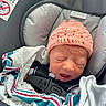 Amelia joined the competition — help win amazing prizes! newborn, baby, infant, crying, sleepy, car_seat, seatbelt, pink_hat, crochet_hat, blanket, hospital_blanket, portrait, close_up, face, eyes_closed, vehicle, safety_harness, seated, indoors, photography