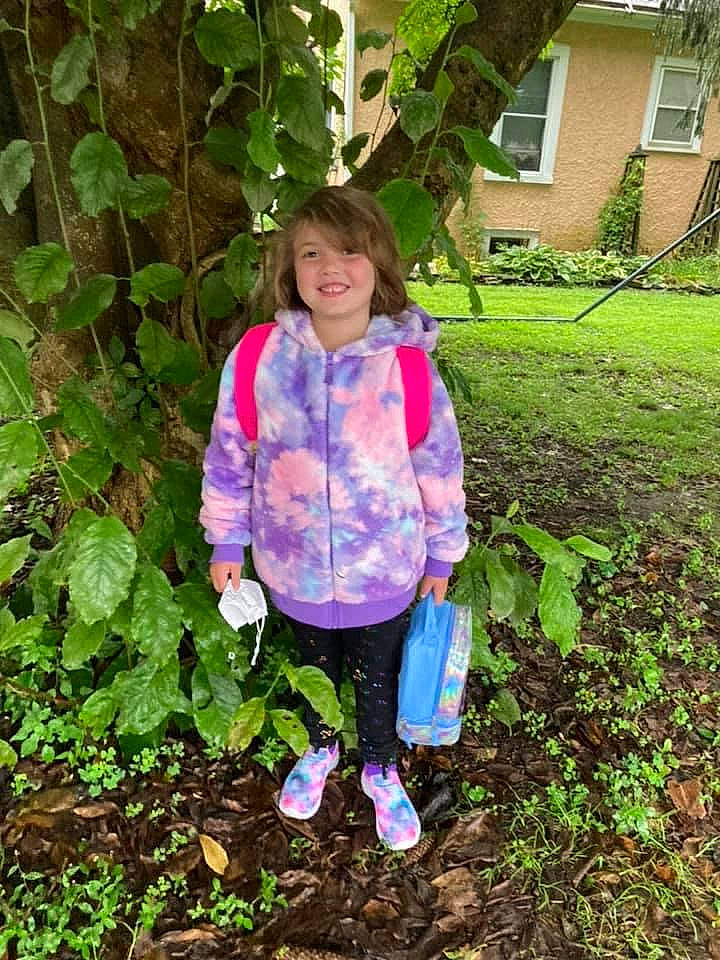 Amiya is registered to the contest to win money with this photo: baby_toddler_clothing, clothing, garden, grass, grass_family, green, groundcover, happy, jacket, joy, magenta, natural_environment, nature, people_in_nature, person, pink, plant, sleeve, smile, toddler
