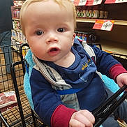 Milo'Kai is registered to the contest to win money with this photo: adult, baby, bodypart, face, finger, food, grocerystore, hand, head, indoors, male, man, market, person, photography, shelf, shop, shopping, shoppingcart, sweets