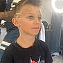 child, boy, haircut, spiderman, tshirt, indoor, portrait, lighting, ring_light, casual, fashion, hairstyle, face, person, young, cute, short_hair, design, style, blue_eyes