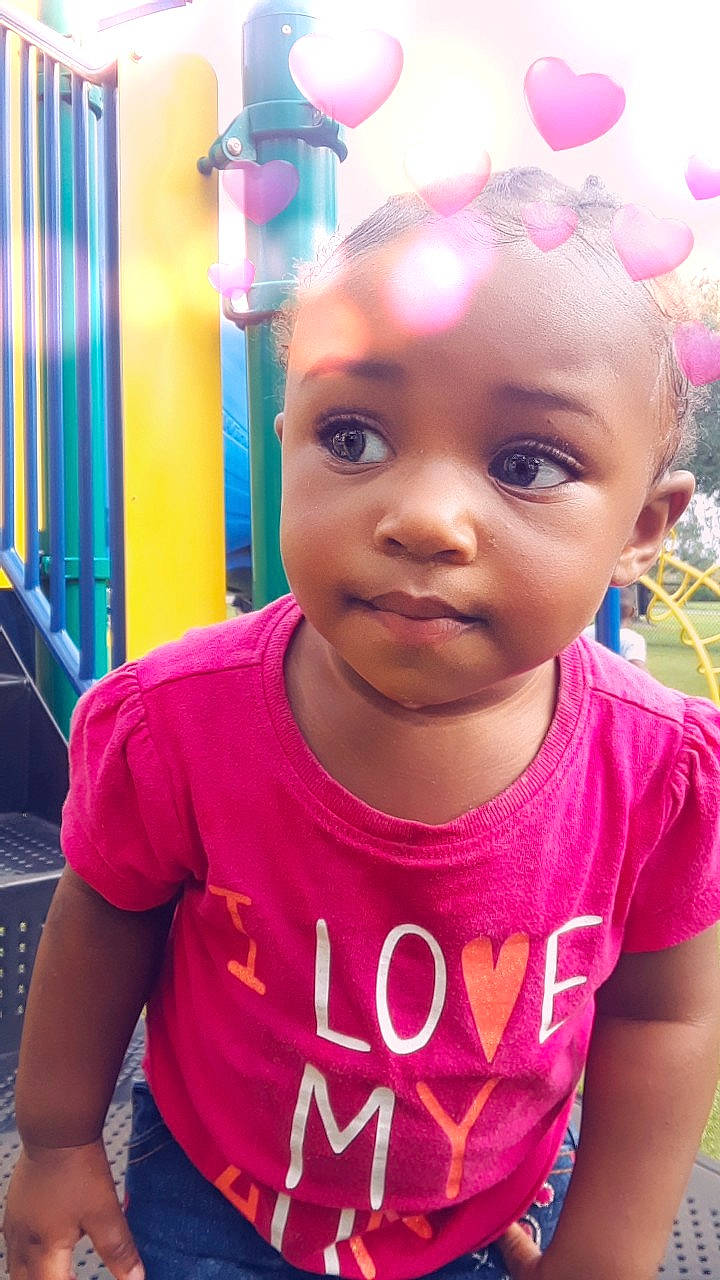 Lee'Ana is registered to the contest to win money with this photo: cheek, child, cool, day, eye, face, fun, girl, hair_coloring, happiness, infant, lip, magenta, organ, person, pink, product, purple, skin, smile