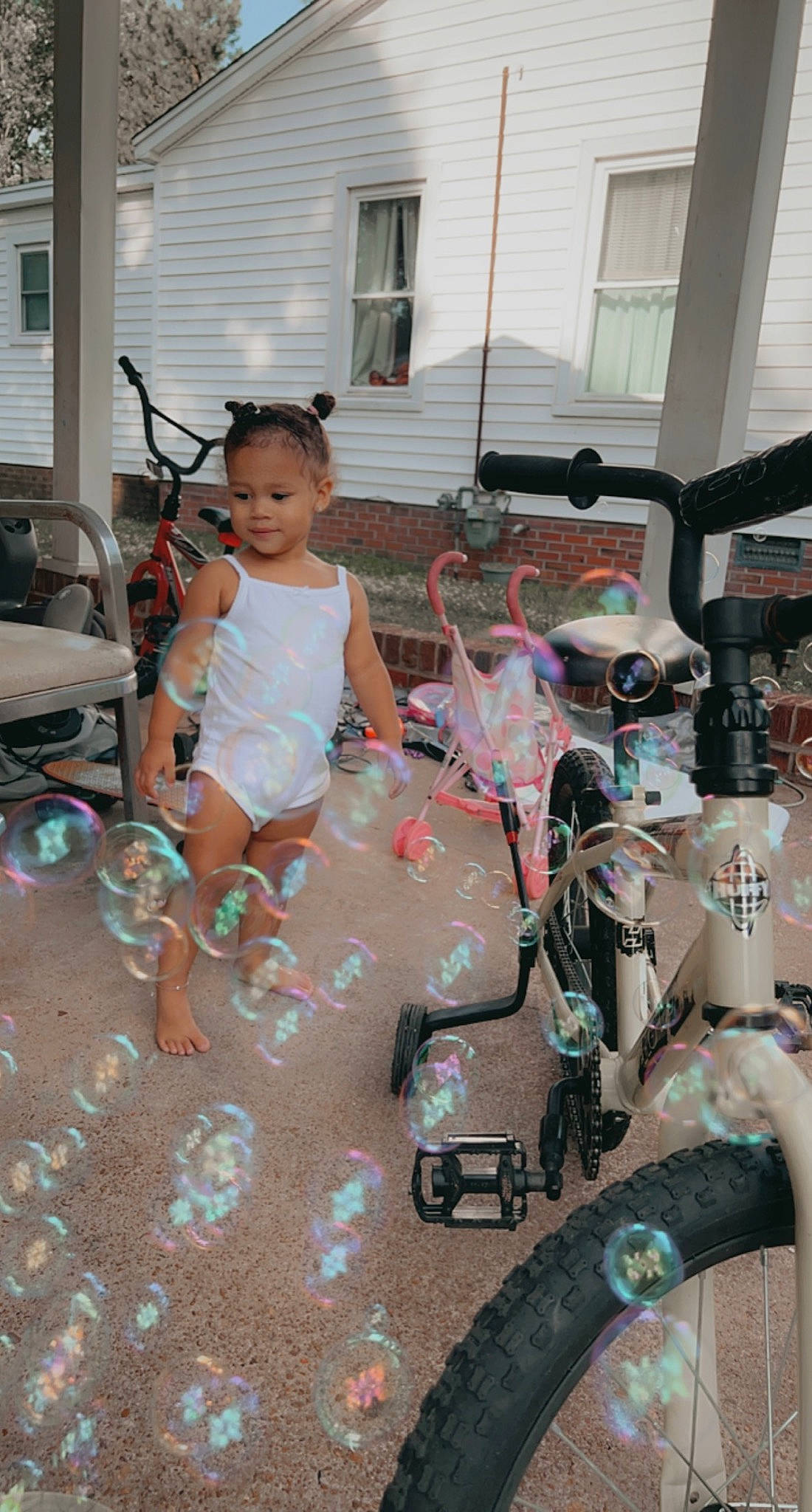 Melody is registered to the contest to win money with this photo: auto_part, automotive_design, automotive_exterior, automotive_tire, bicycle_accessory, child, event, flooring, fun, gas, leisure, machine, motor_vehicle, person, recreation, sandal, shorts, tire, toddler, toy