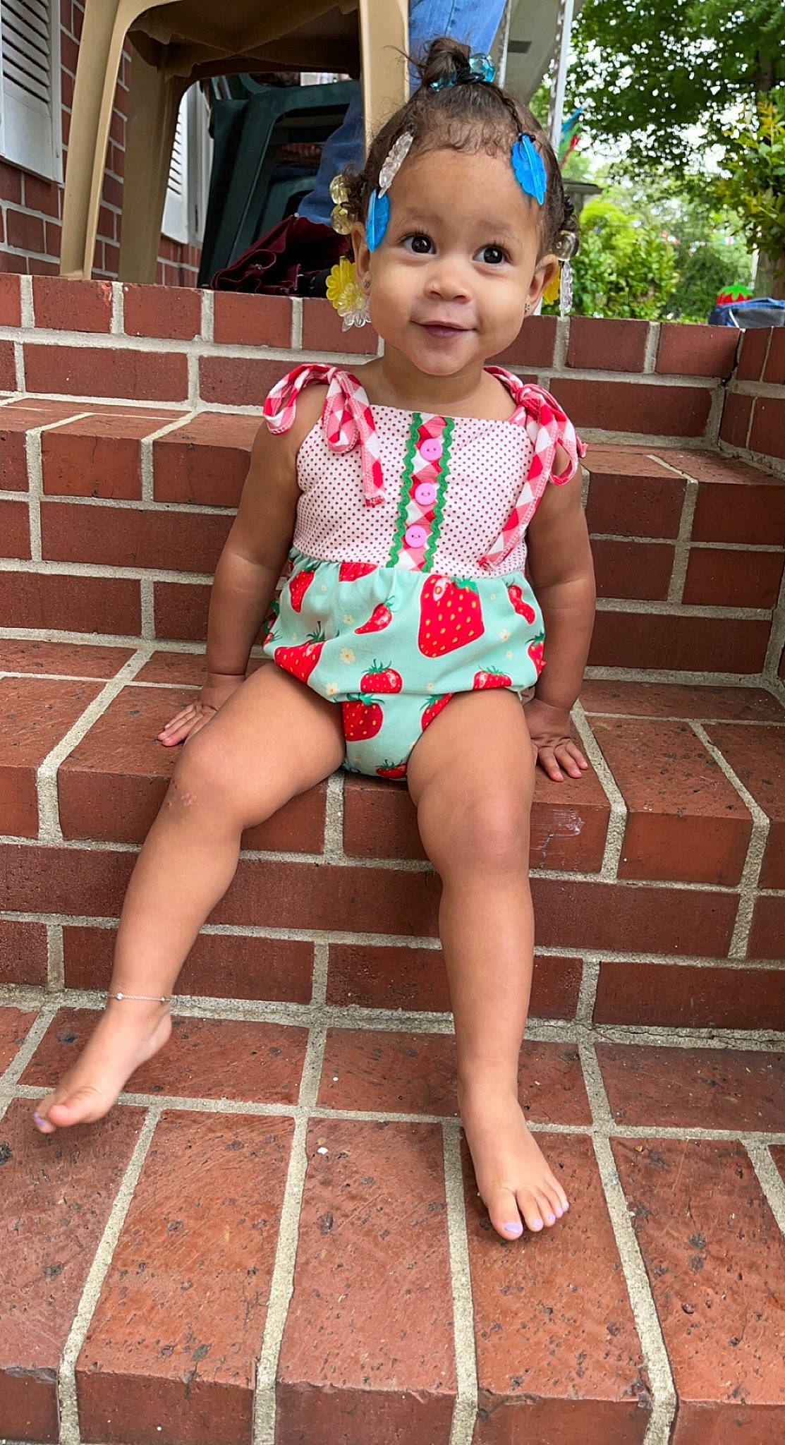 Melody joined the competition — help win amazing prizes! baby_toddler_clothing, barefoot, brick, cheek, child, chin, dress, foot, fun, happy, head, human_leg, pattern, person, pink, sandal, skin, smile, thigh, toddler