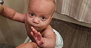Atlas joined the competition — help win amazing prizes! adult_hand, baby, bathroom, candid, child, curtain, diaper, direct_gaze, eyes, face, finger, floor, home, indoors, infant, laundry, portrait, standing, support, wobbling