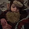 Atlas is registered to the contest to win money with this photo: animal_hat, baby, blanket, brown, candid, child, clothing, costume, cozy, dim_lighting, face, furry, indoors, moose_costume, person, plush, portrait, seated, sleepy, toddler