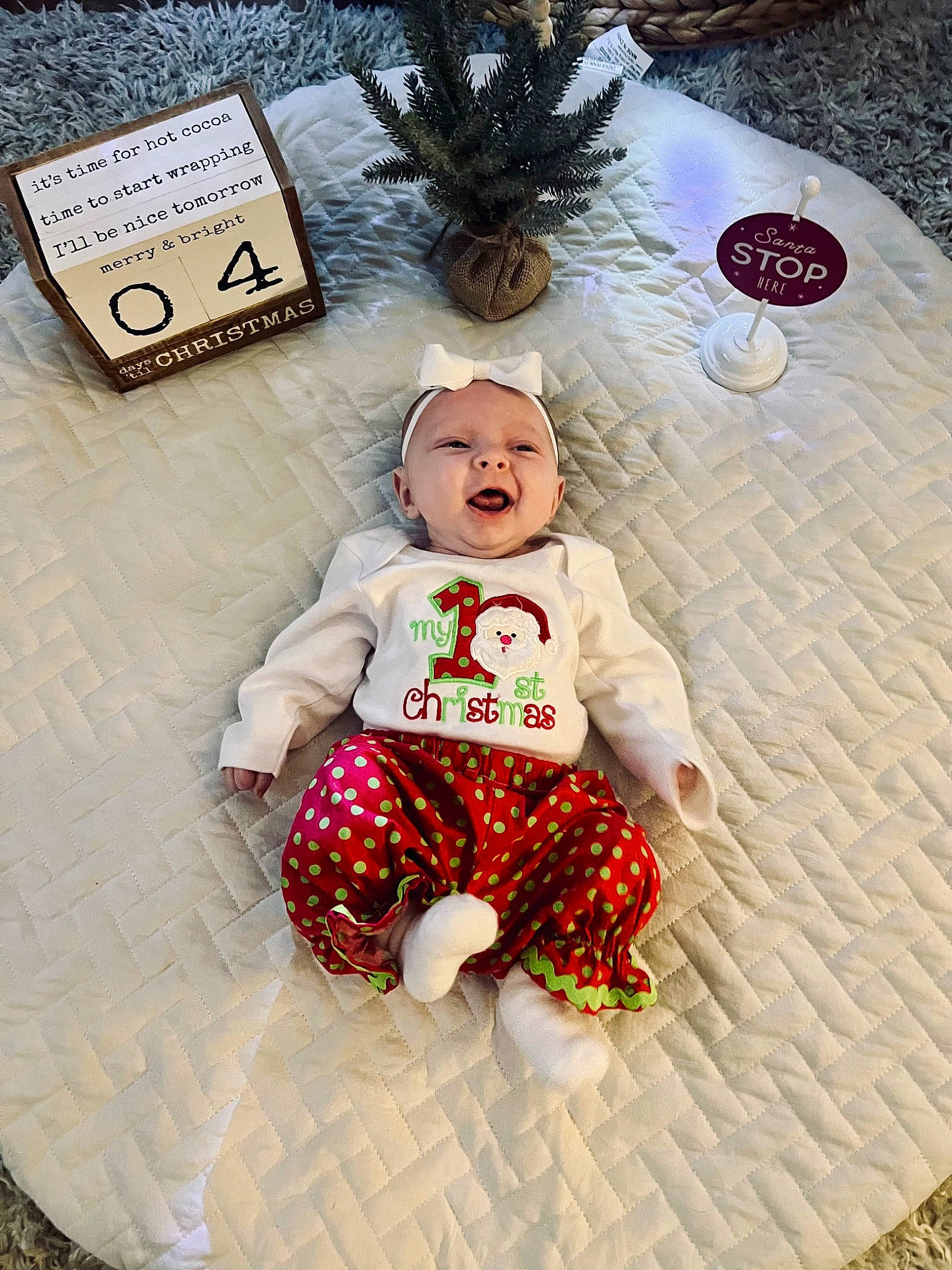 Suttyn is registered to the contest to win money with this photo: baby, baby_toddler_clothing, child, event, font, fur, grass, happy, pattern, person, plush, room, sitting, sleeve, stuffed_toy, textile, toddler, toy, winter
