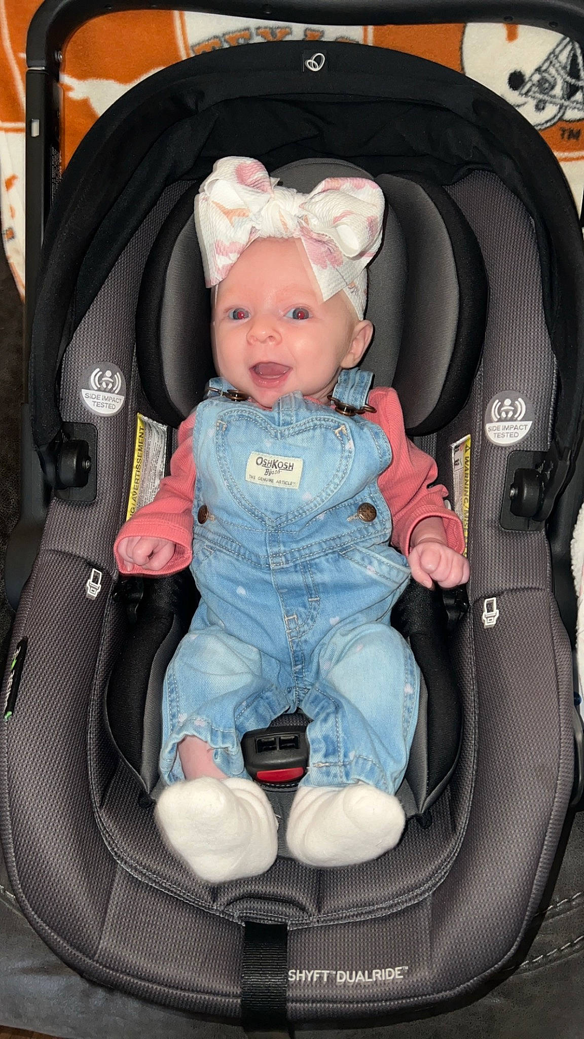Suttyn joined the competition — help win amazing prizes! auto_part, baby, baby_carriage, baby_in_car_seat, baby_products, baby_safety, baby_toddler_clothing, bag, car_seat, chair, child, comfort, fashion_accessory, person, product, sitting, smile, toddler