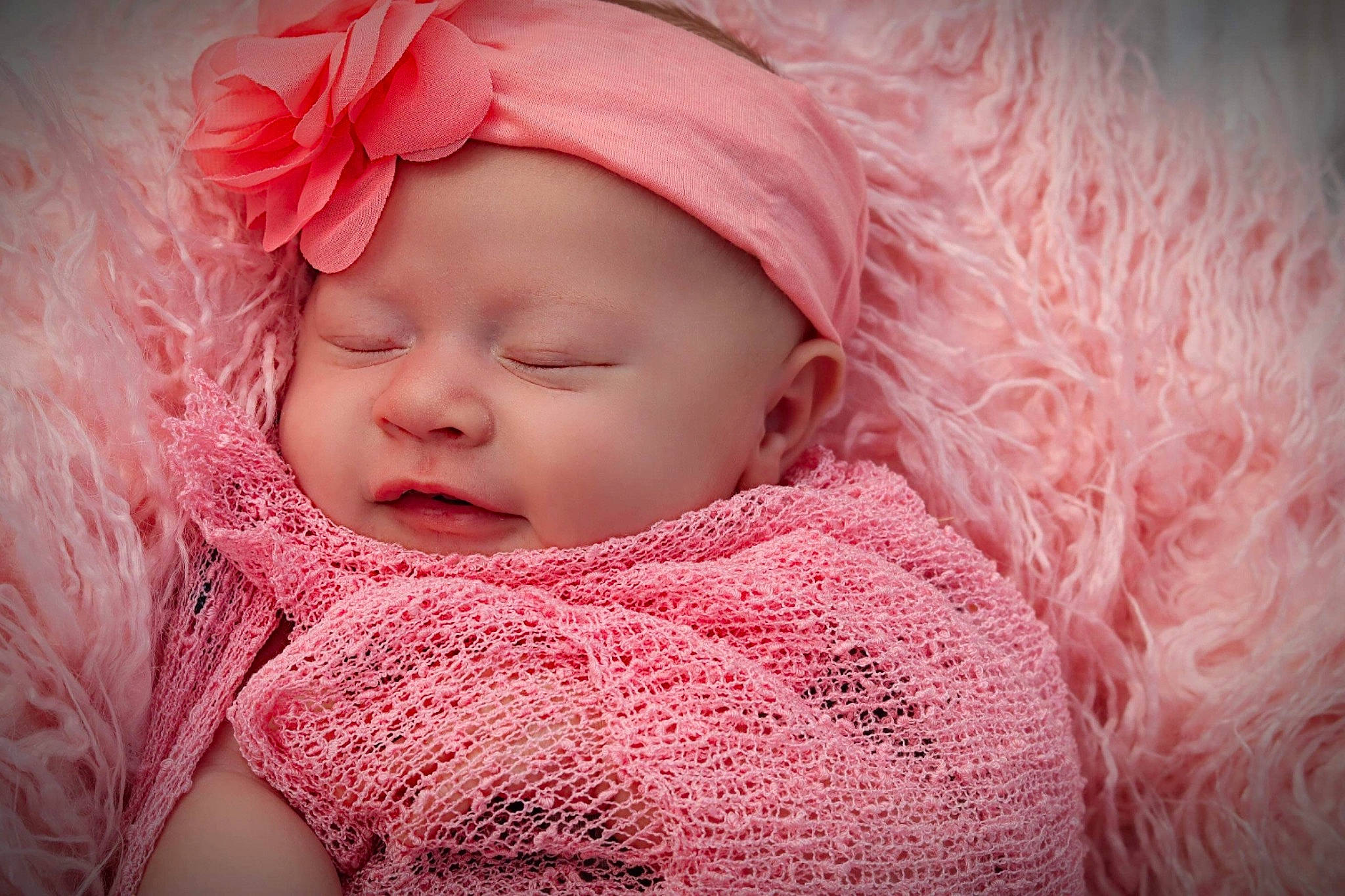 Emma is registered to the contest to win money with this photo: baby, baby_sleeping, baby_toddler_clothing, cheek, chin, clothing, comfort, face, happy, headgear, headwear, lip, magenta, nose, outerwear, person, petal, pink, skin, textile