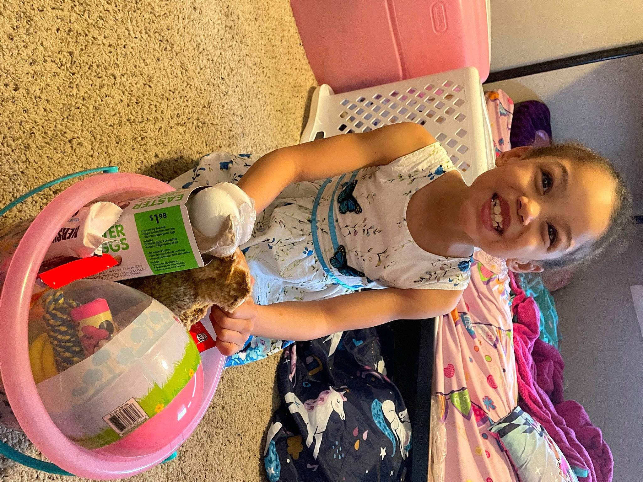 Shanika is registered to the contest to win money with this photo: bag, ball, child, fun, happy, joy, leisure, magenta, pattern, person, personal_protective_equipment, pink, play, room, sitting, smile, t_shirt, toddler, toy, travel