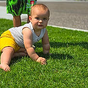 Liam is registered to the contest to win money with this photo: baby, babycrawling, bodypart, boy, child, clothing, crawling, face, finger, grass, hand, head, lawn, male, person, photography, plant, portrait, shorts, t_shirt