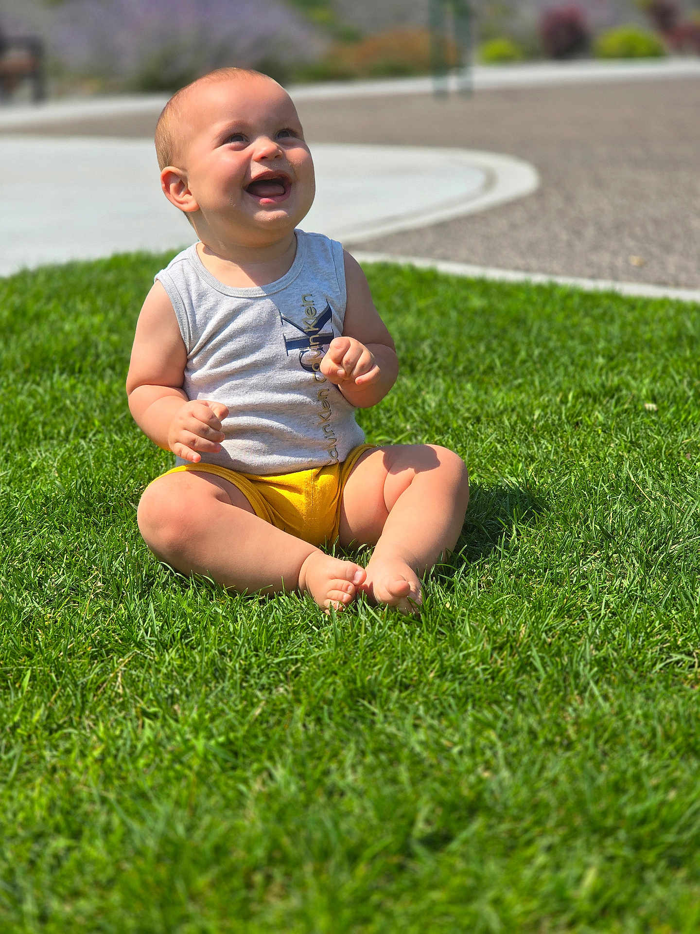 Liam joined the competition — help win amazing prizes! baby, babylaughing, bodypart, clothing, face, finger, grass, hand, happy, head, laughing, lawn, outdoors, person, photography, plant, portrait, shorts, sitting, summer