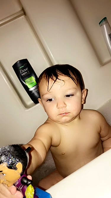 Clayton is registered to the contest to win money with this photo: arm, baby, black_hair, cheek, chin, ear, eyebrow, eyelash, face, finger, gesture, hand, iris, lip, mouth, muscle, neck, nose, person, skin